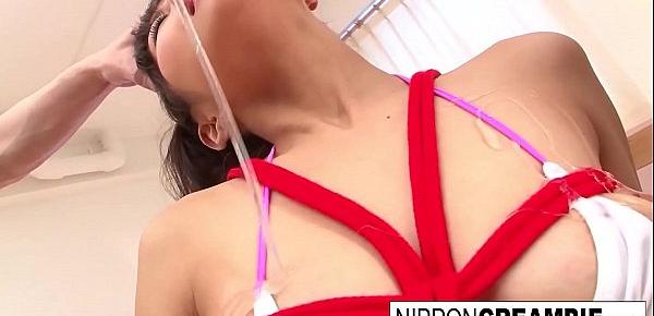  Roped up Japanese babe has a threesome